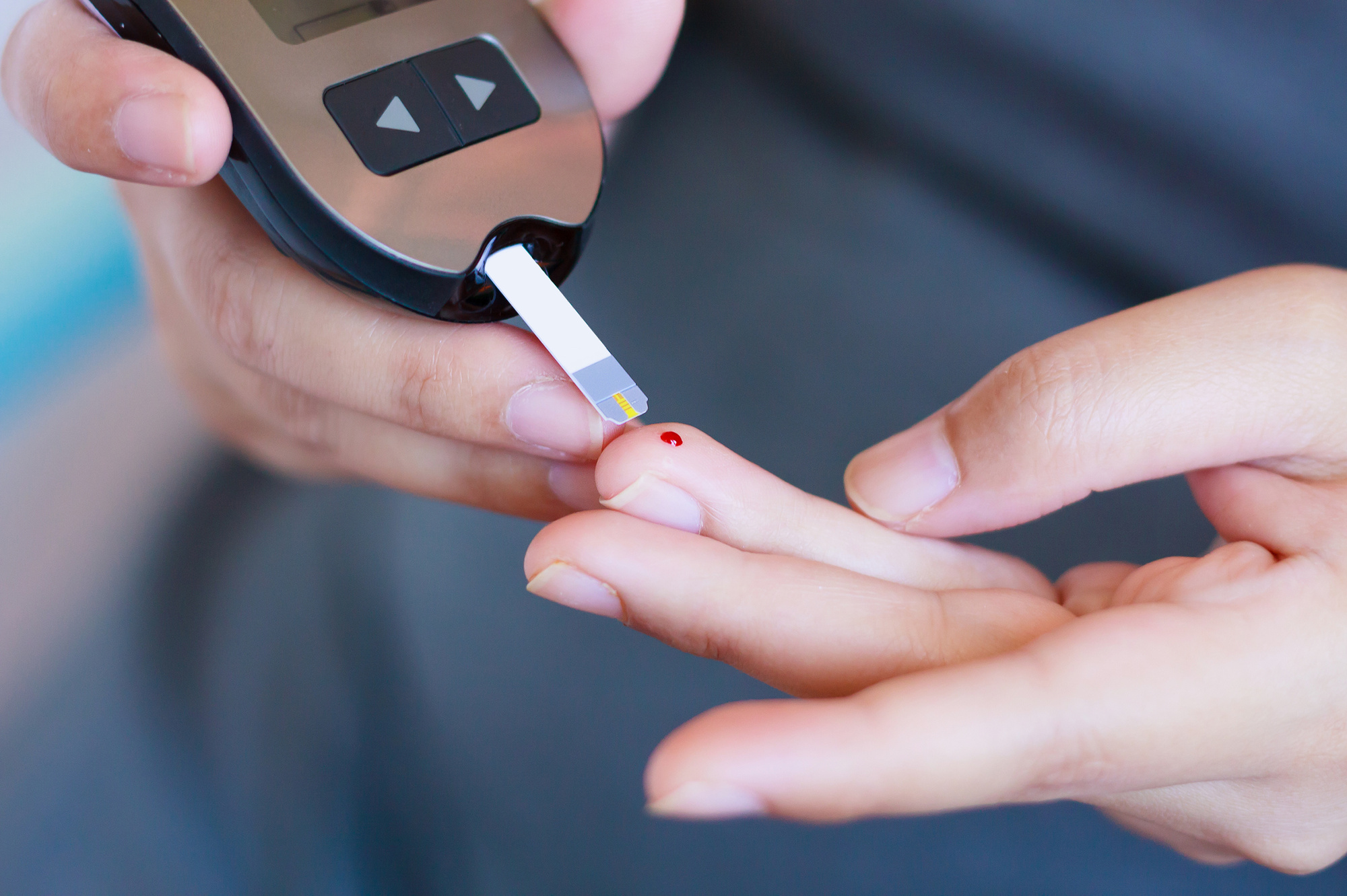 person taking blood sugar test